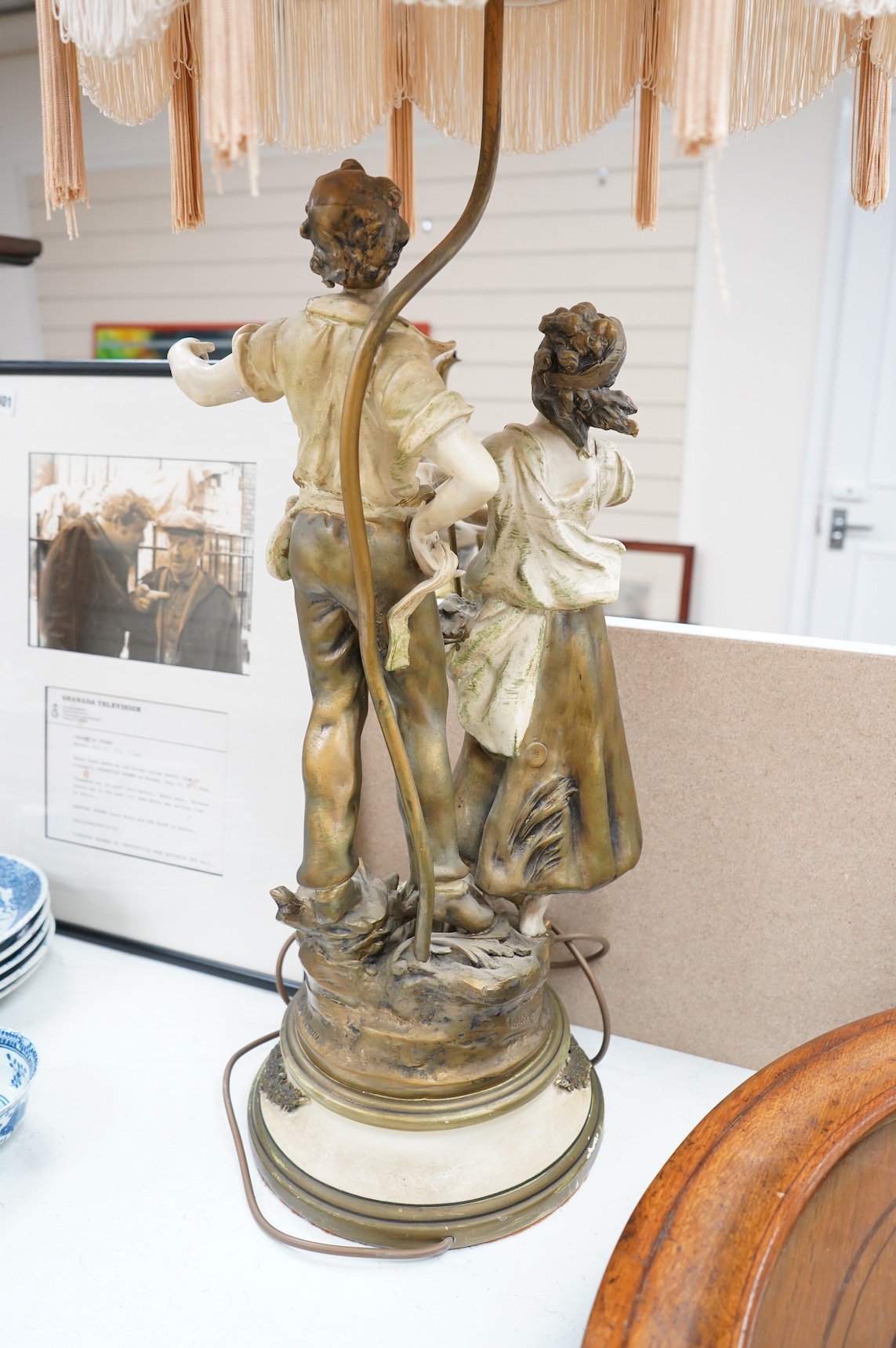 A figural spelter lamp with shade, 90cm high